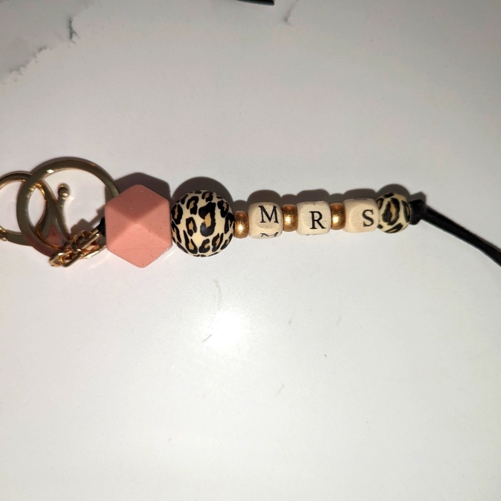 2 pack. MRS and RPN keychains. Brand new. Cheetah print.